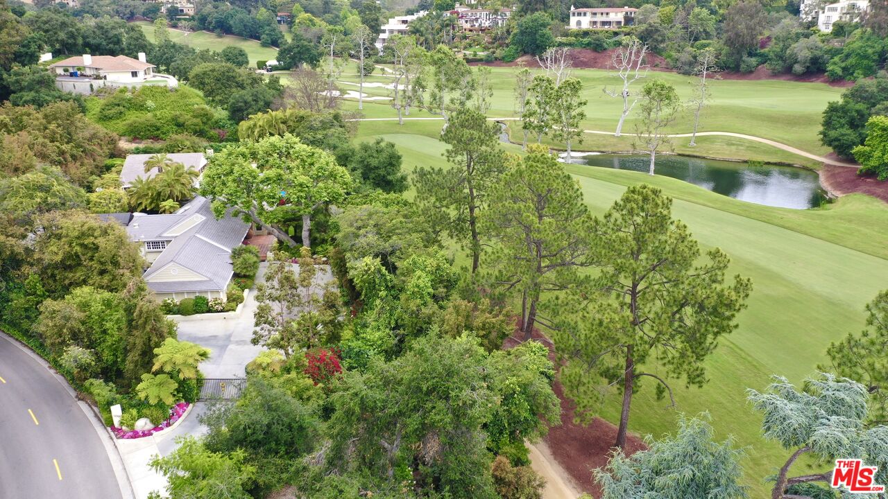 10957 Bellagio Road Los Angeles, CA 90077 - Photo 18 of 18 an aerial view of residential houses with outdoor space and trees