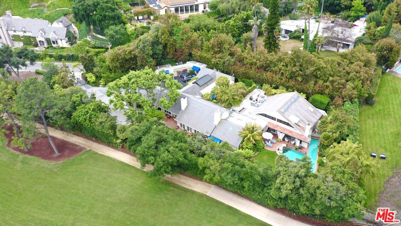 10957 Bellagio Road Los Angeles, CA 90077 - Photo 2 of 18 an aerial view of residential house with outdoor space and trees all around