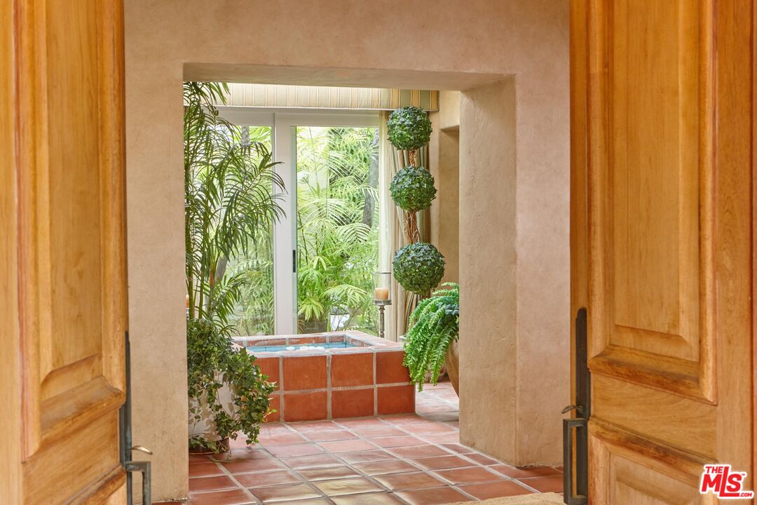 10957 Bellagio Road Los Angeles, CA 90077 - Photo 5 of 18 a house view with a garden space