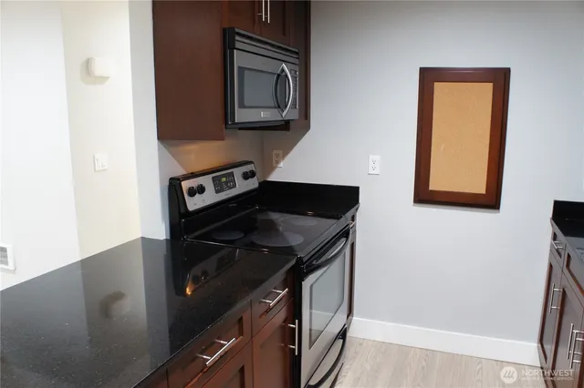 a kitchen with a stove and a microwave