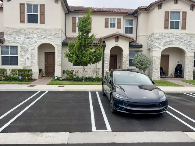 a view of entryway with stairs and wooden floor