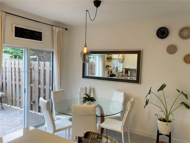 a bedroom with a bed and a tv