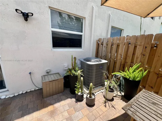 a view of a bedroom with washer and dryer
