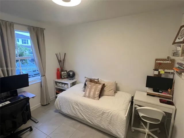 a bathroom with a double vanity sink toilet mirror and shower