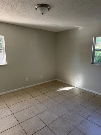 a white toilet sitting next to a bath tub