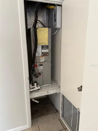 a view of a room with an empty space and windows