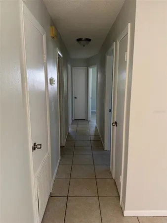 an empty room with a wooden door