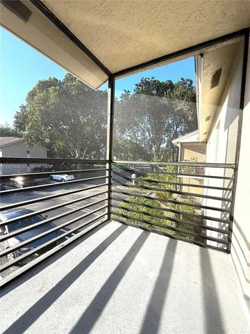 a view of a glass door with the floor to ceiling windows