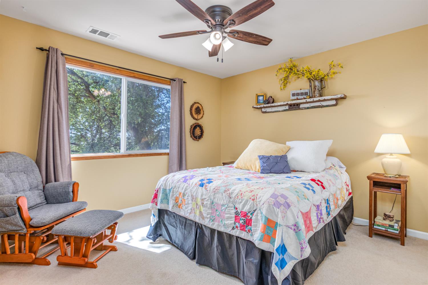 9290 Cramer Road Auburn, CA 95602 - Photo 34 of 67 a bedroom with a bed and a chandelier