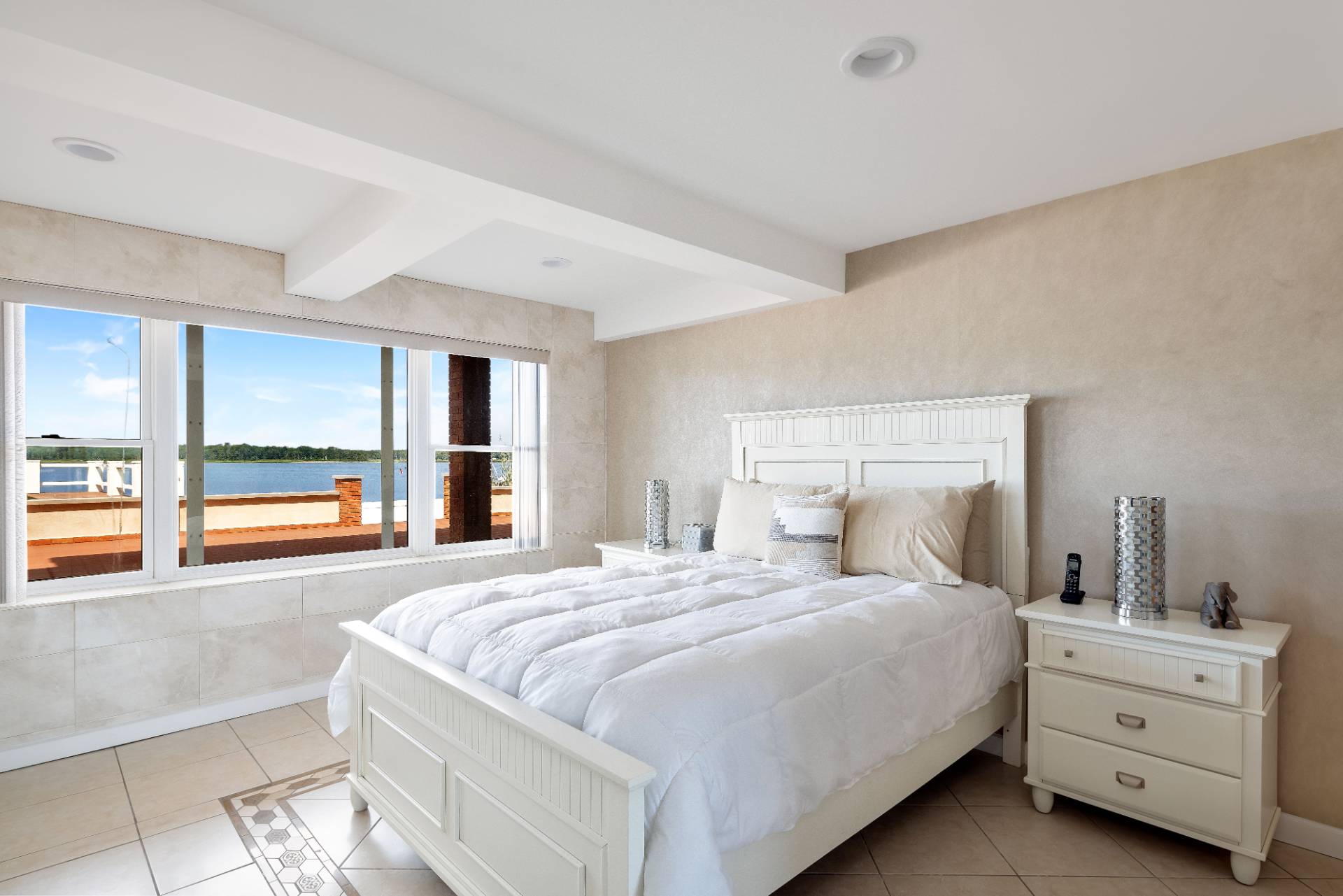 69 B Little Pine Lane East Quogue, NY 11942 - Photo 11 of 34 a bedroom with a bed and a large window