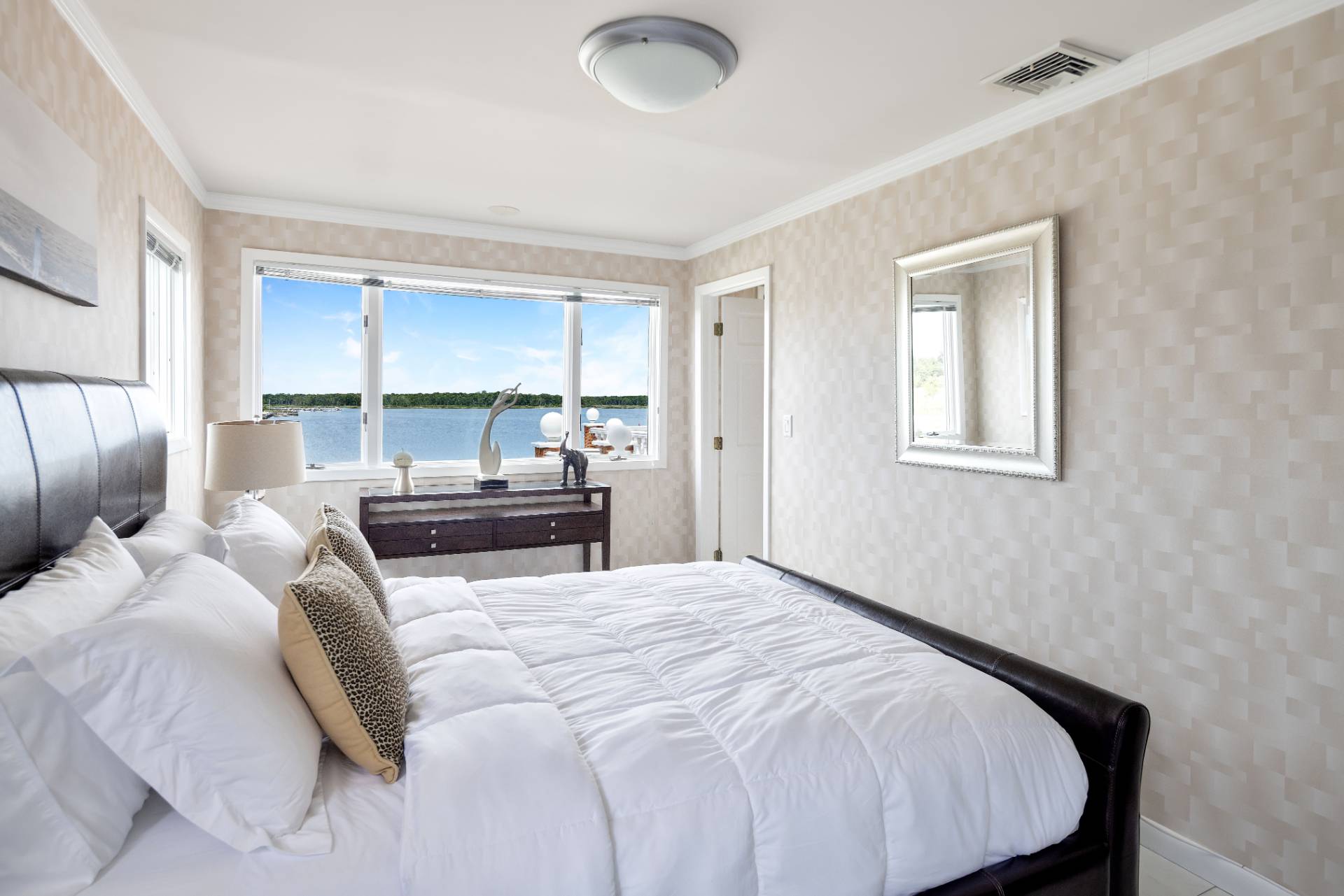 69 B Little Pine Lane East Quogue, NY 11942 - Photo 15 of 34 a bedroom with a bed and a window