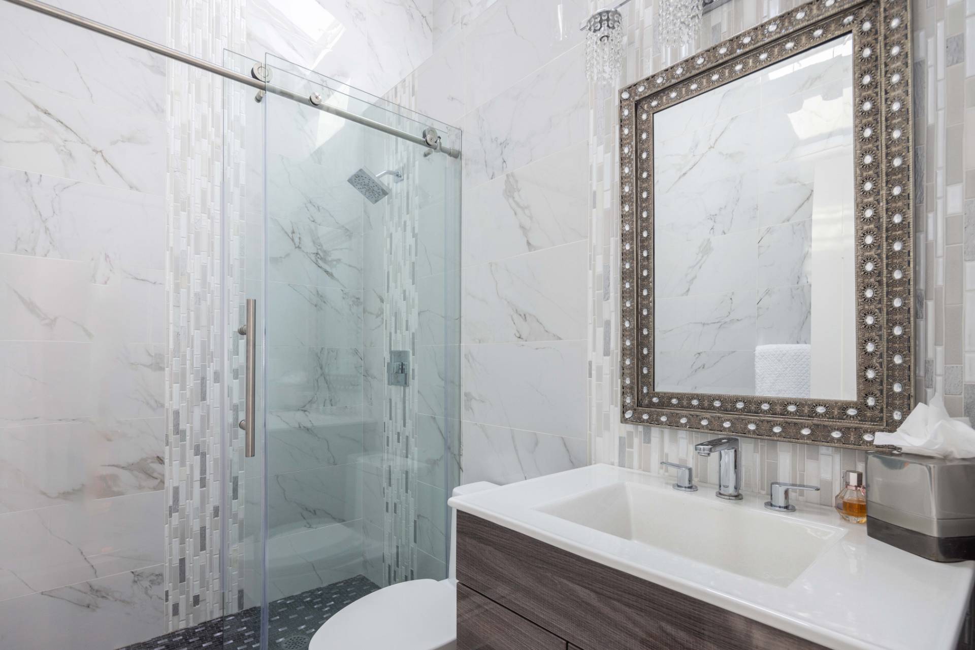 69 B Little Pine Lane East Quogue, NY 11942 - Photo 18 of 34 a bathroom with a sink and a mirror