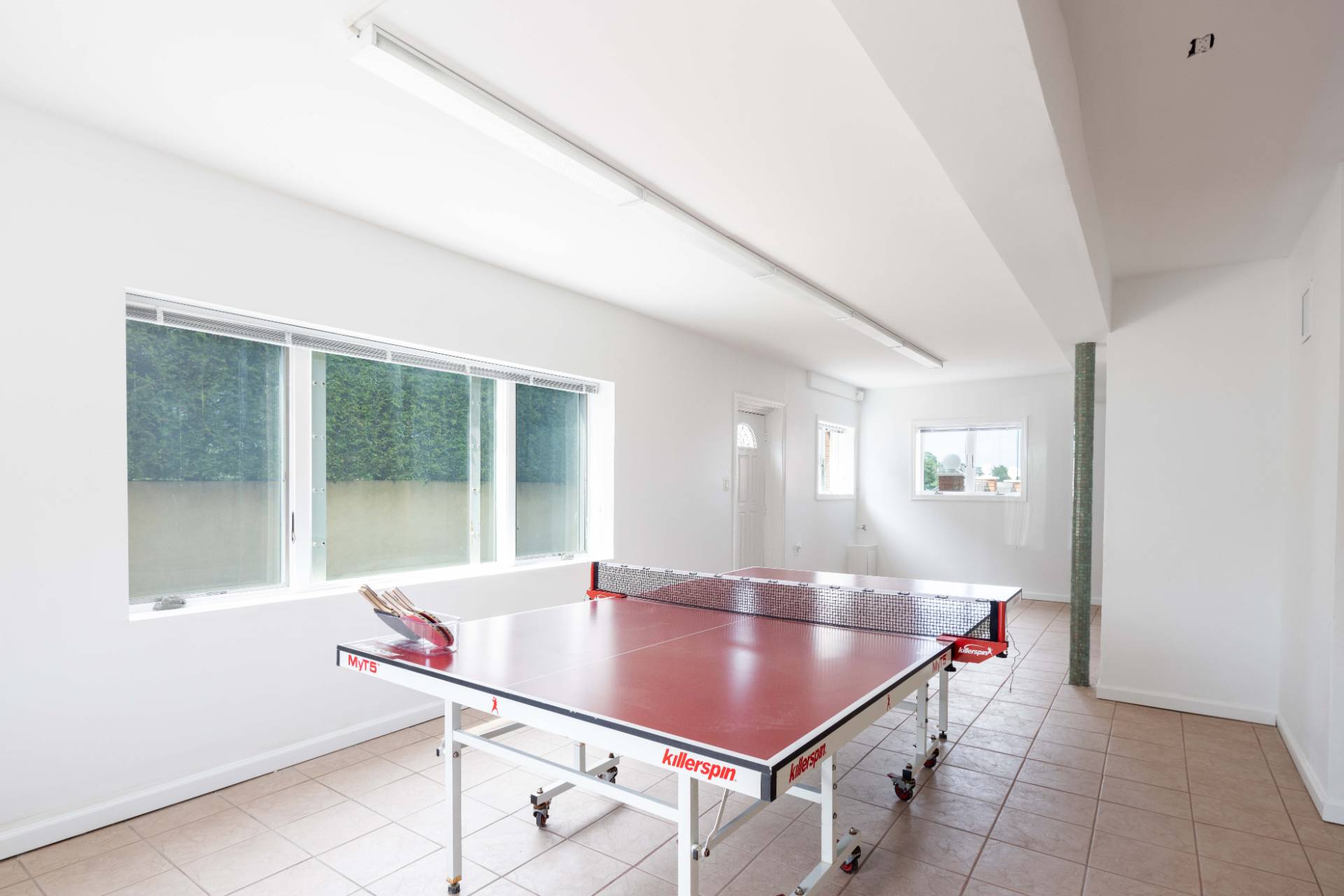 69 B Little Pine Lane East Quogue, NY 11942 - Photo 20 of 34 a room with pool table and windows