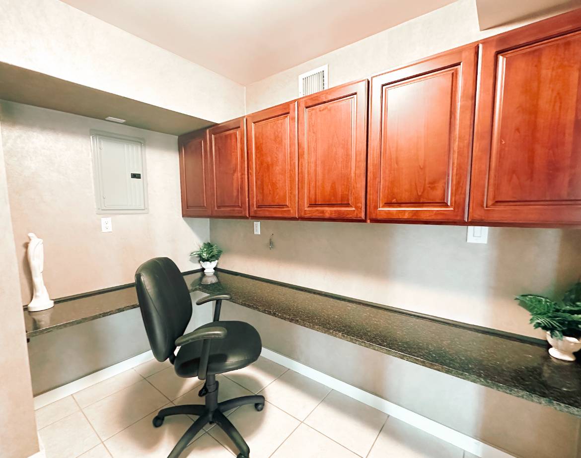 69 B Little Pine Lane East Quogue, NY 11942 - Photo 23 of 34 a kitchen with a chair and cabinets