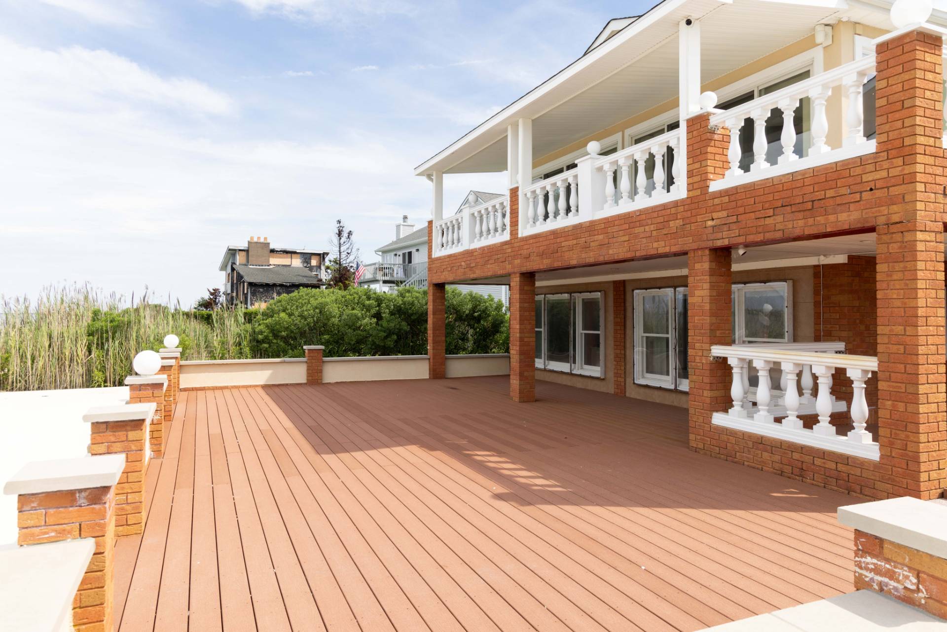 69 B Little Pine Lane East Quogue, NY 11942 - Photo 25 of 34 a view of a house with roof deck
