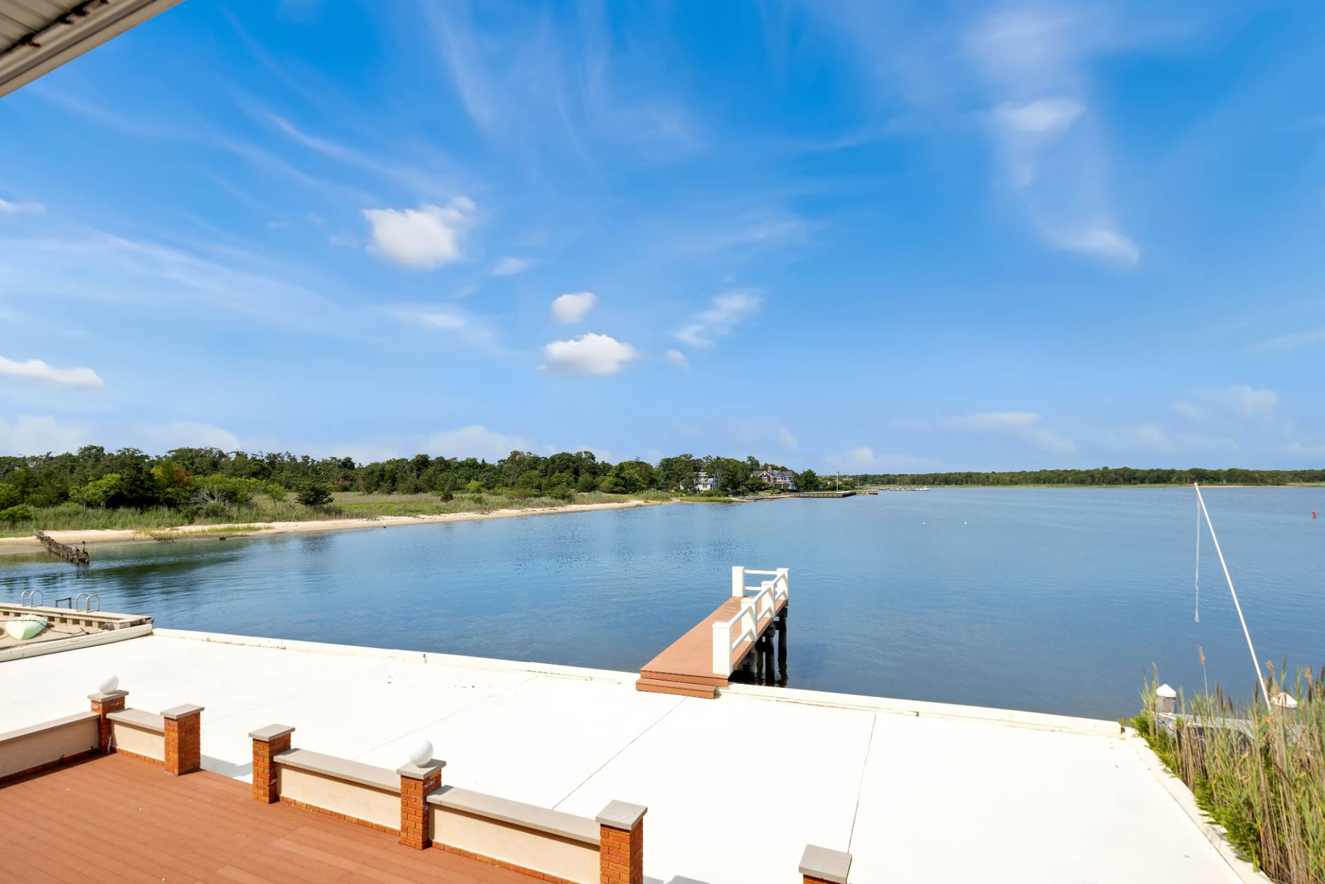 69 B Little Pine Lane East Quogue, NY 11942 - Photo 28 of 34 a view of a lake with houses in the back