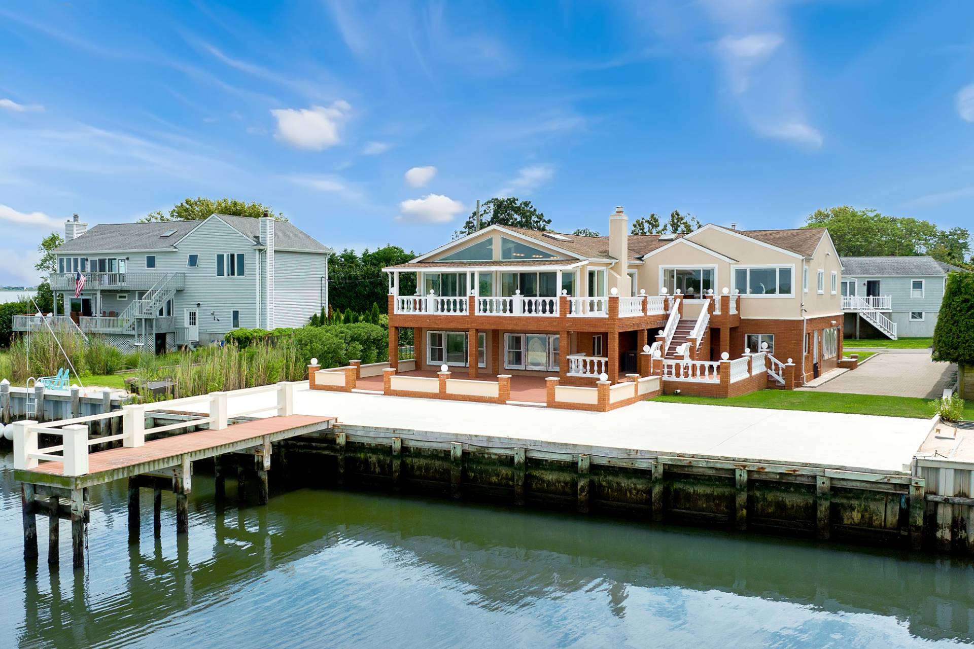 69 B Little Pine Lane East Quogue, NY 11942 - Photo 30 of 34 a view of a house with outdoor space and sitting area