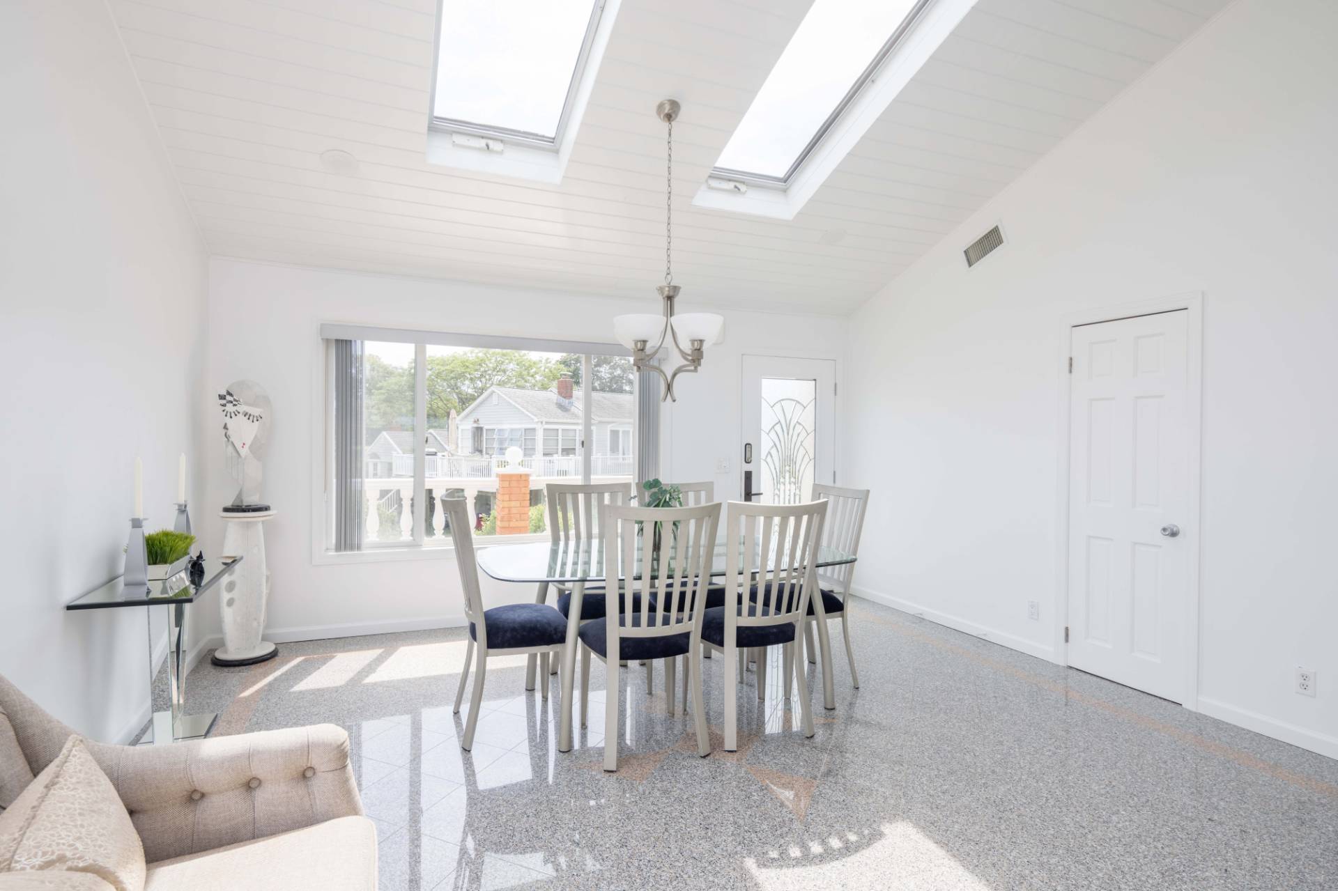 69 B Little Pine Lane East Quogue, NY 11942 - Photo 3 of 34 a view of a dining room with furniture window and outside view