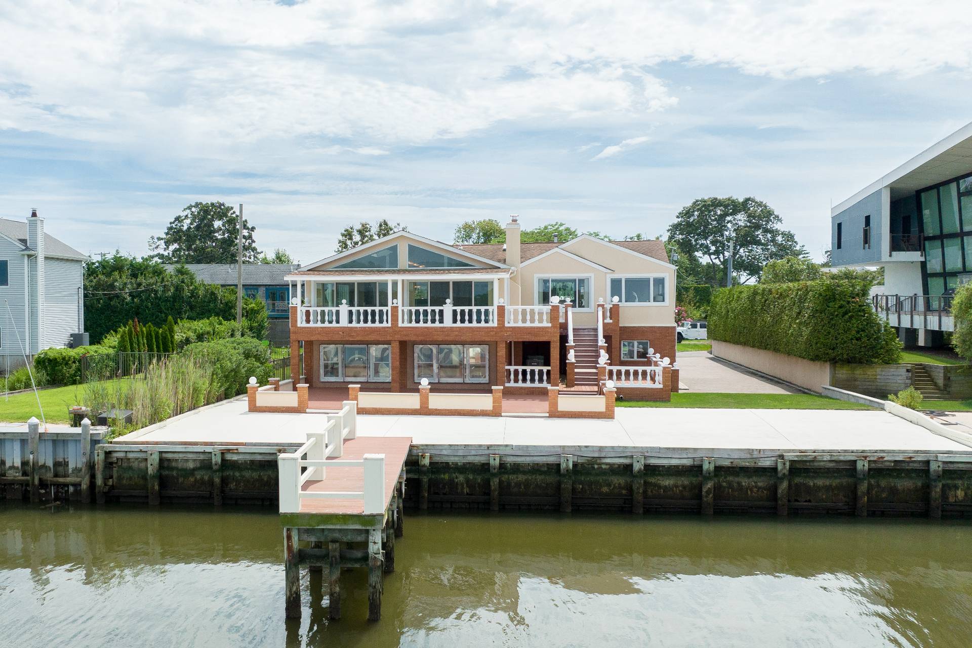 69 B Little Pine Lane East Quogue, NY 11942 - Photo 31 of 34 a balcony with seating space and lake view