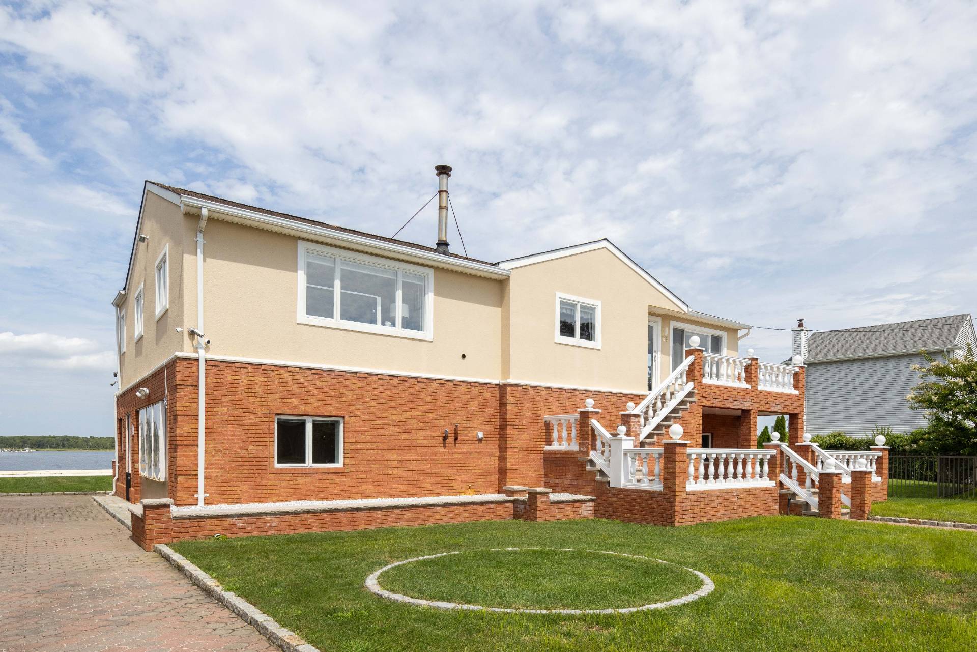 69 B Little Pine Lane East Quogue, NY 11942 - Photo 32 of 34 a backyard of a house with table and chairs