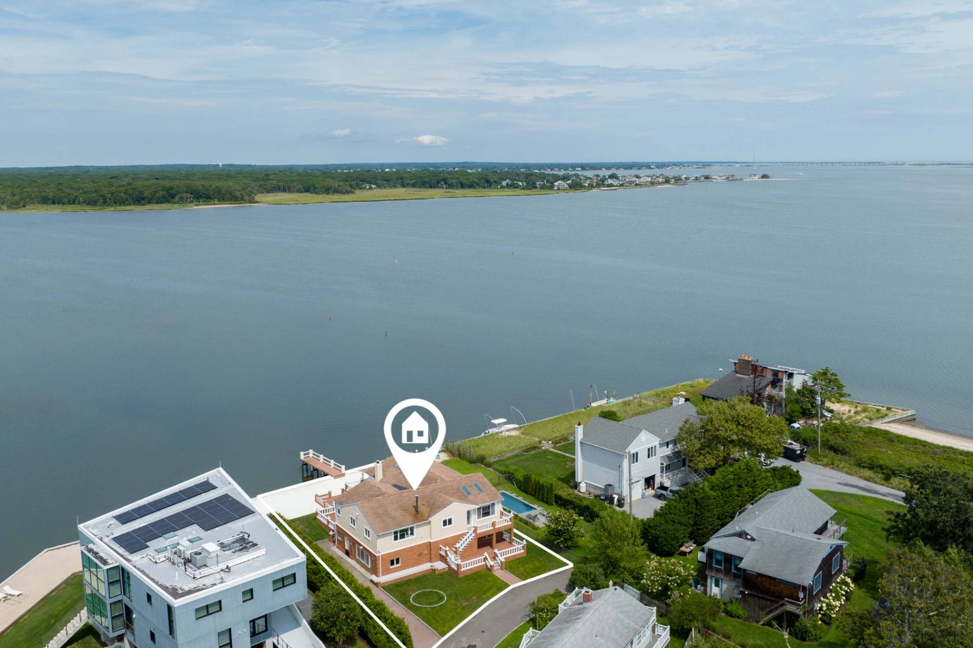 69 B Little Pine Lane East Quogue, NY 11942 - Photo 33 of 34 a aerial view of a house with a lake view