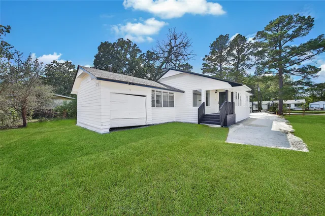 a view of a yard with a house and garden
