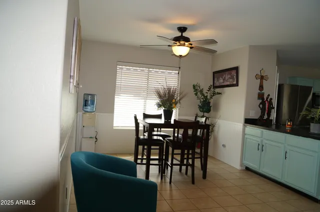 a kitchen with a sink and a refrigerator