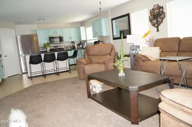 a bedroom with bed and a chandelier