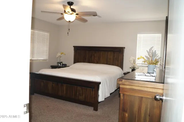 a view of a livingroom with furniture and a flat screen tv