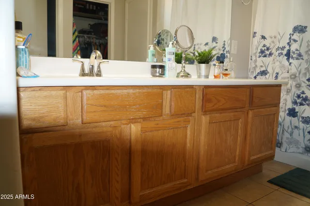 a room with furniture a chandelier and a window