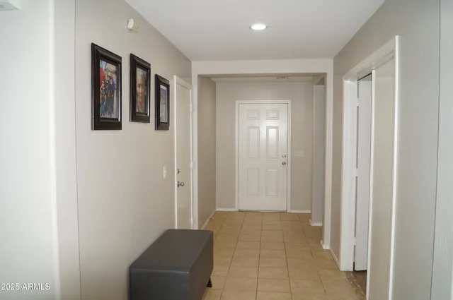 a view of a room with a window and ceiling fan