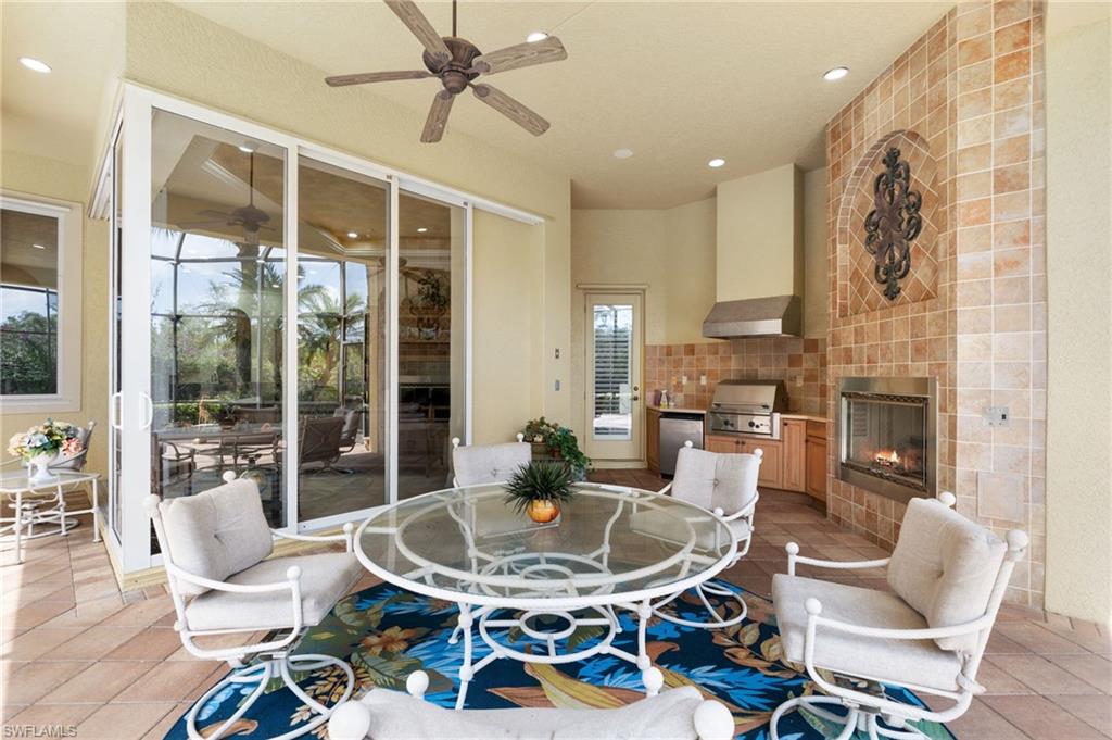 20421 Chapel Trace Estero, FL 33928 - Photo 14 of 50 a living room with fireplace furniture and a large window