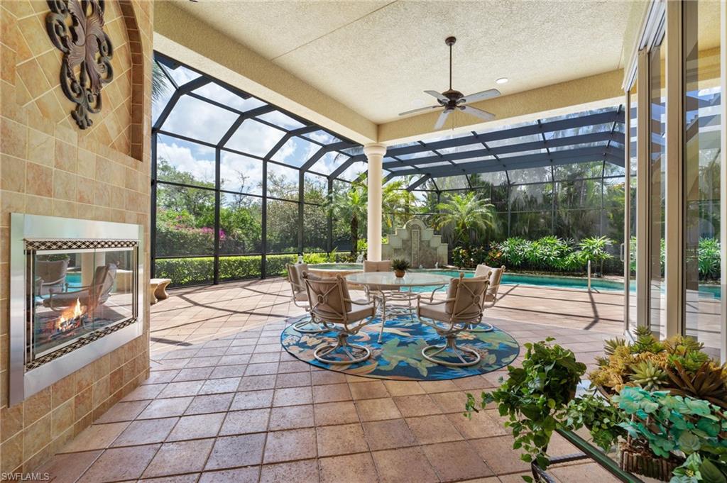 20421 Chapel Trace Estero, FL 33928 - Photo 15 of 50 a view of a porch with dining table and chairs