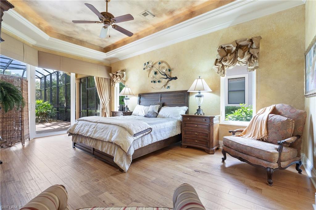 20421 Chapel Trace Estero, FL 33928 - Photo 20 of 50 a spacious bedroom with a bed and window