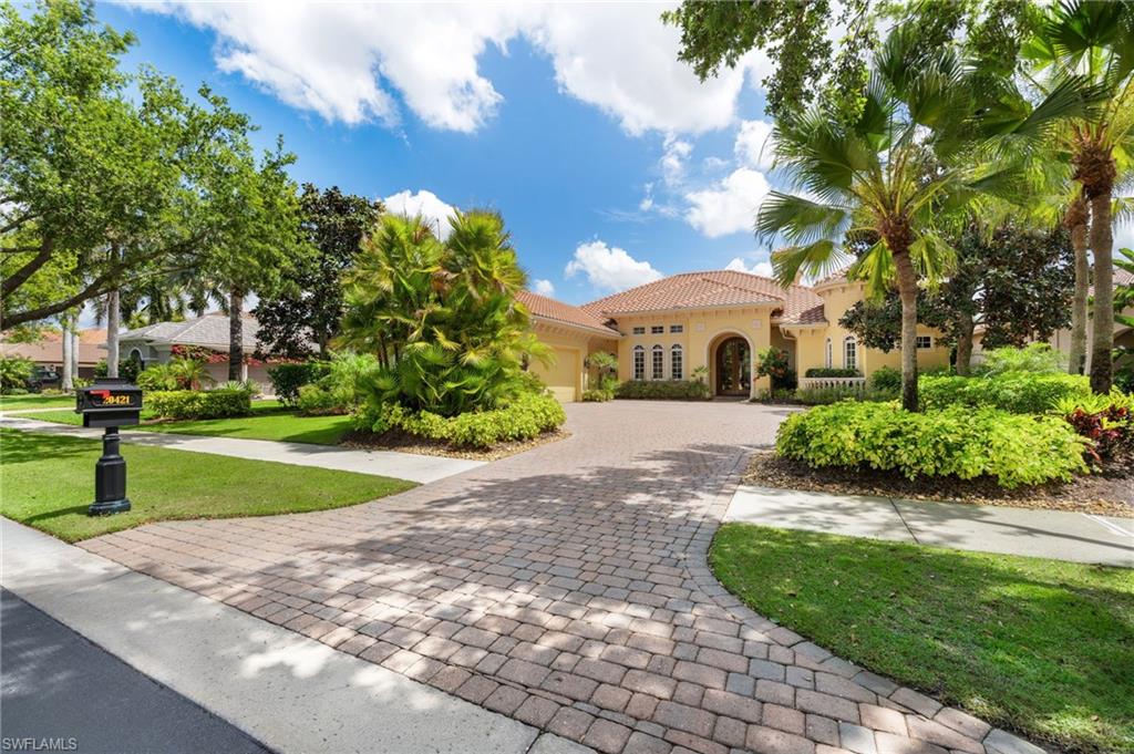 20421 Chapel Trace Estero, FL 33928 - Photo 2 of 50 a front view of a house with a yard and shrubs