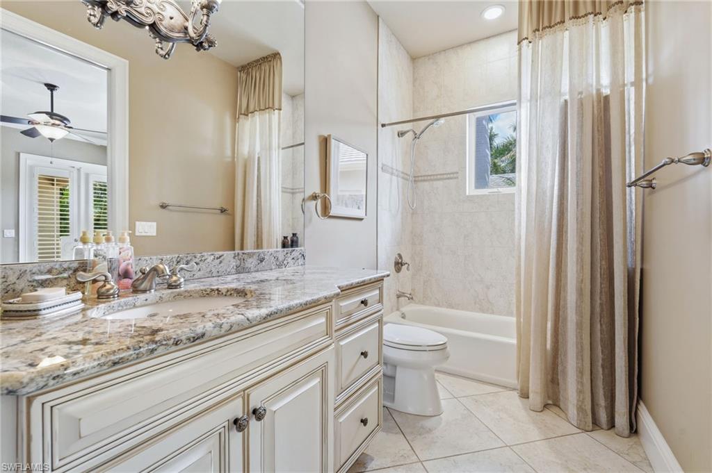 20421 Chapel Trace Estero, FL 33928 - Photo 26 of 50 a bathroom with a granite countertop sink toilet and shower