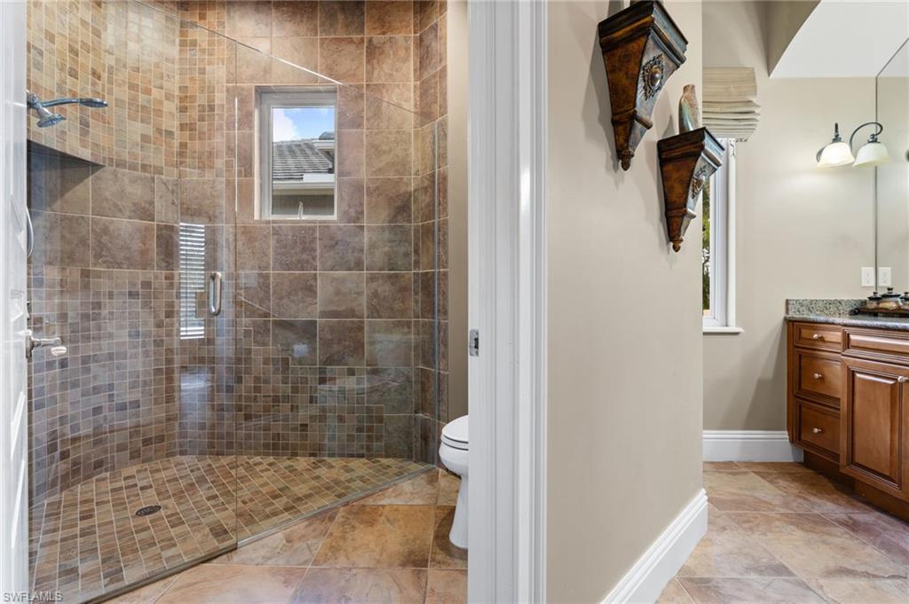 20421 Chapel Trace Estero, FL 33928 - Photo 28 of 50 a bathroom with a shower