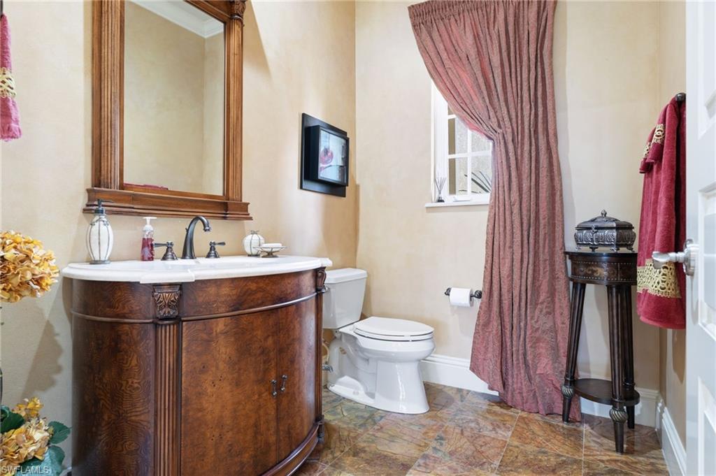 20421 Chapel Trace Estero, FL 33928 - Photo 30 of 50 a bathroom with a sink and a mirror