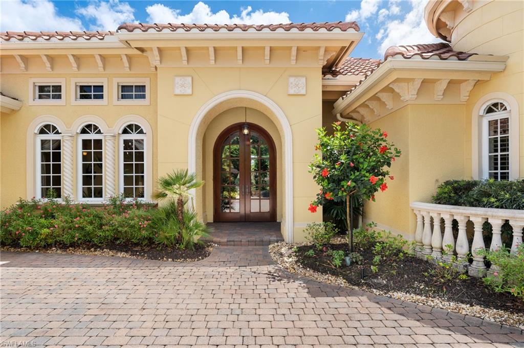 20421 Chapel Trace Estero, FL 33928 - Photo 3 of 50 a front view of a house with garden