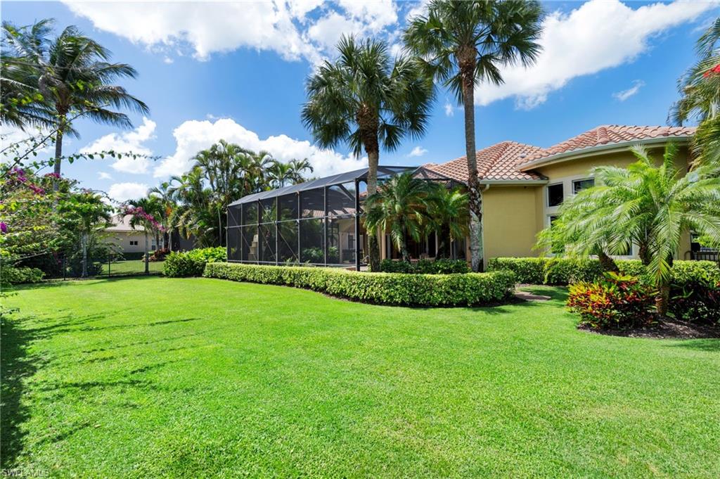 20421 Chapel Trace Estero, FL 33928 - Photo 33 of 50 a view of a garden with a palm tree