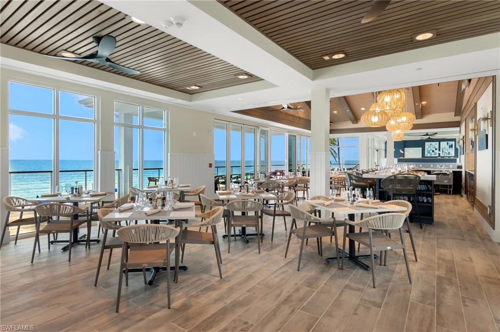 20421 Chapel Trace Estero, FL 33928 - Photo 36 of 50 a lots of tables and chairs in a large kitchen