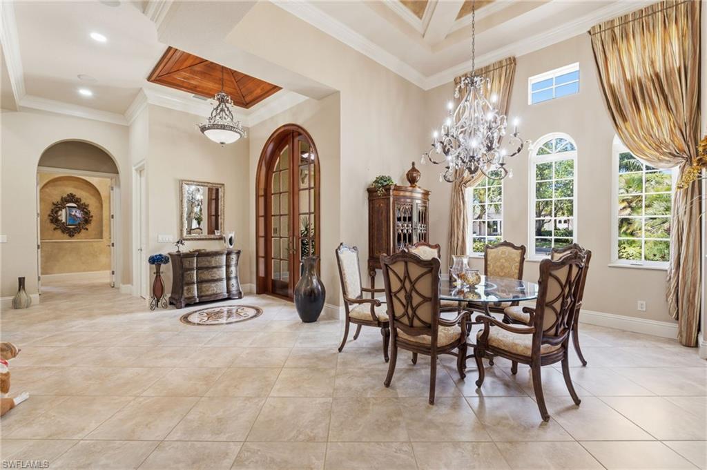 20421 Chapel Trace Estero, FL 33928 - Photo 5 of 50 a view of a dining room with furniture and a chandelier
