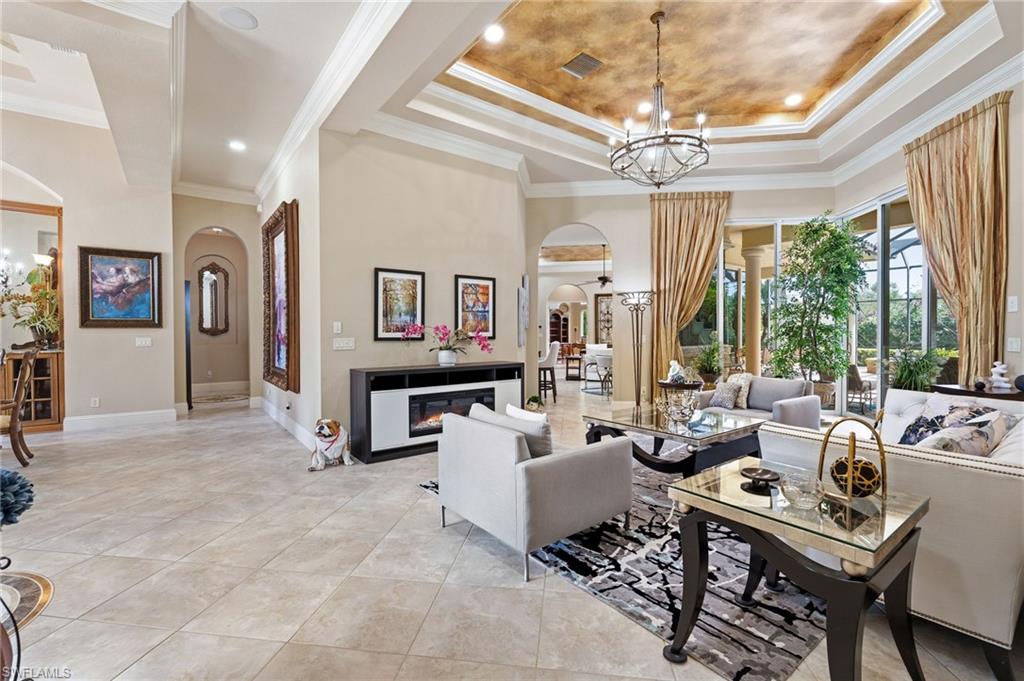20421 Chapel Trace Estero, FL 33928 - Photo 6 of 50 a living room with furniture a flat screen tv and a large window