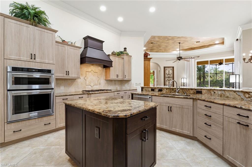 20421 Chapel Trace Estero, FL 33928 - Photo 10 of 50 a kitchen with a sink stove and microwave