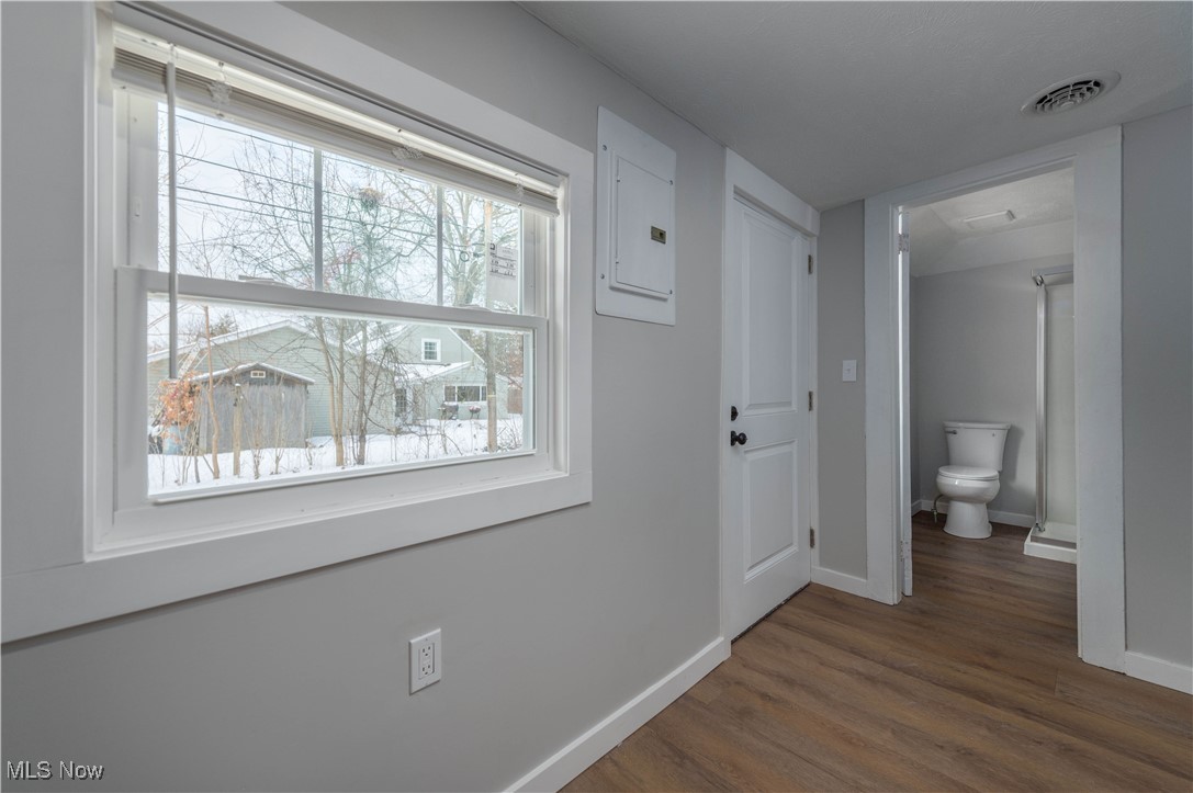 218 Roxboro Road Vermilion, OH 44089 - Photo 30 of 50 Hallway with electric panel and dark wood finished floors