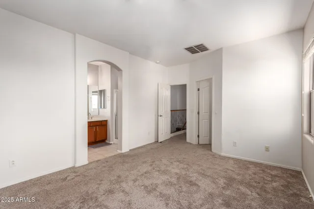 a view of an empty room and fire place