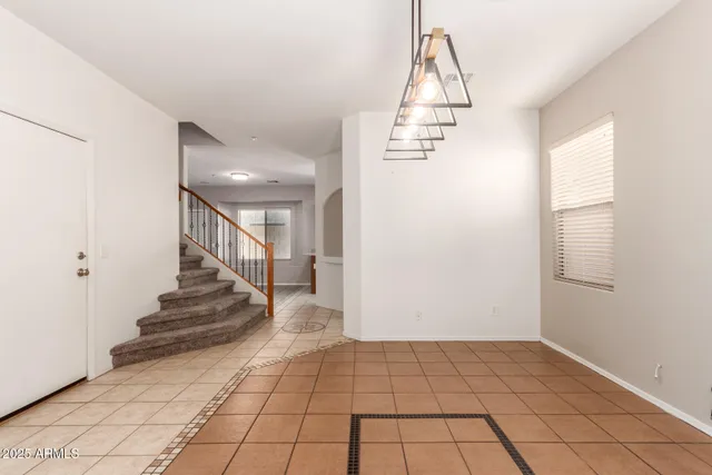 a view of entryway and hall with a window