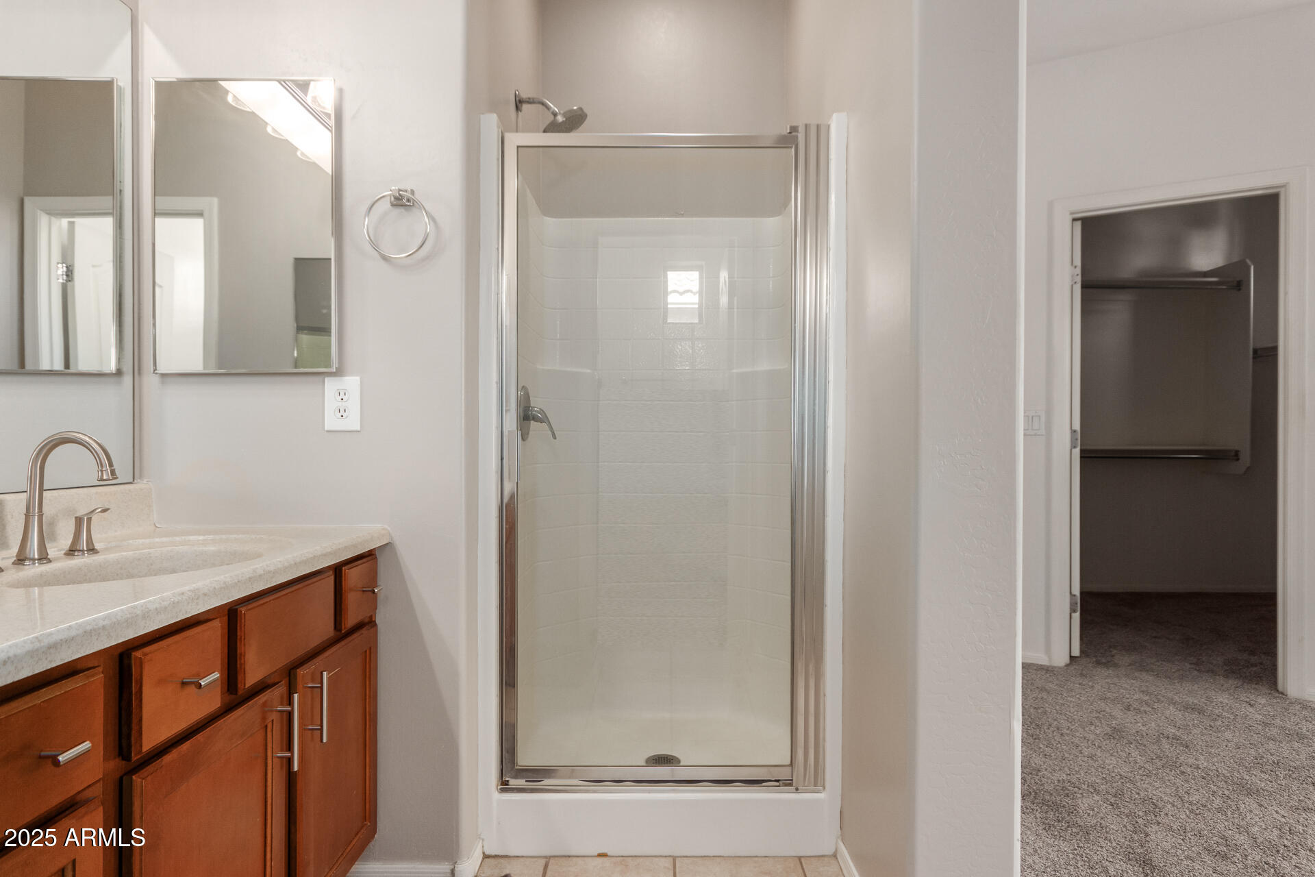 15820 North 74th Drive Peoria, AZ 85382 - Photo 22 of 33 a bathroom with a shower sink and mirror