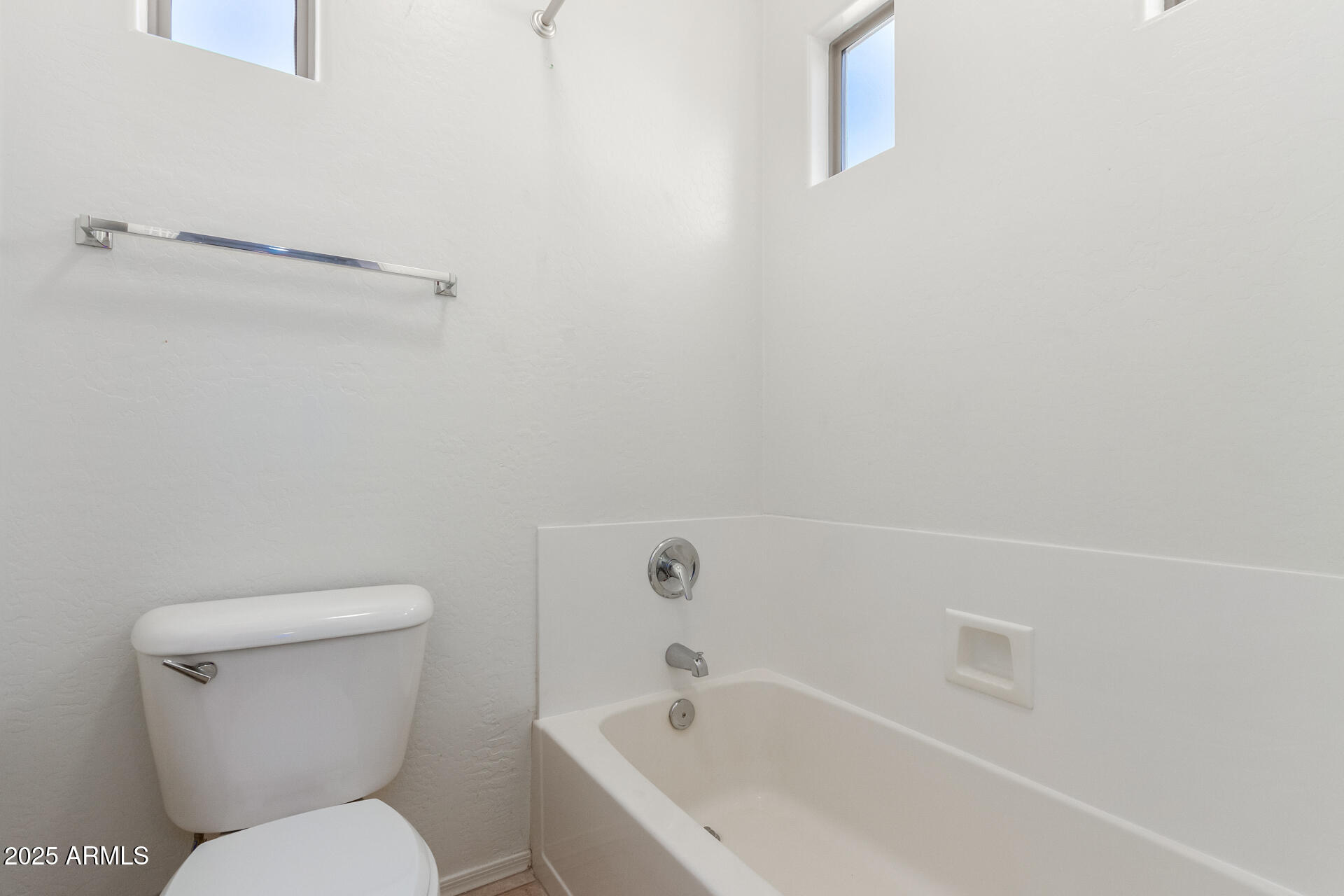 15820 North 74th Drive Peoria, AZ 85382 - Photo 23 of 33 a white toilet sitting next to a bath tub