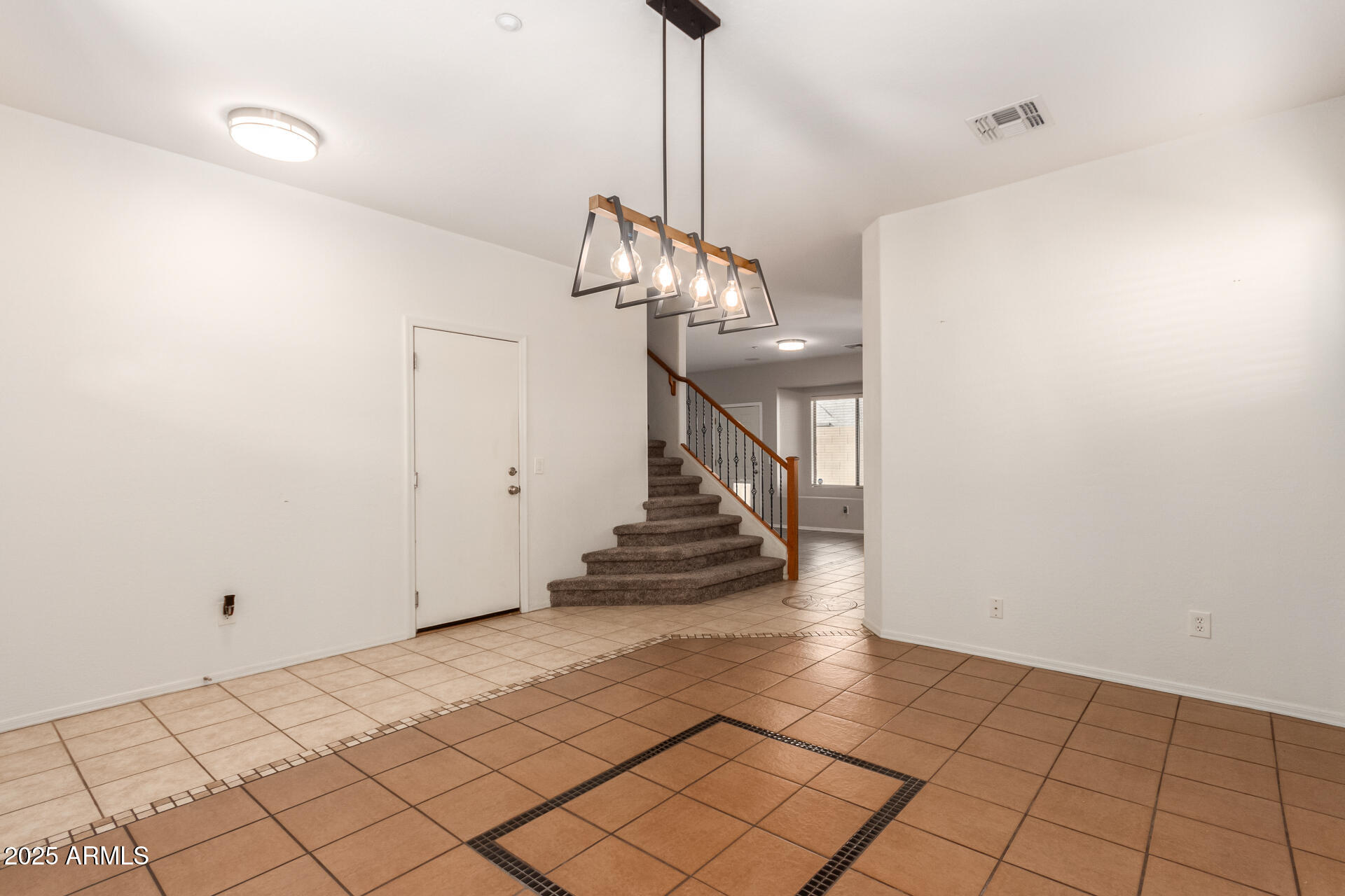 15820 North 74th Drive Peoria, AZ 85382 - Photo 3 of 33 a view of entryway and hall with a chandelier
